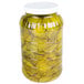 A jar of Harvest Fresh Dill Pickle Slices in yellow liquid.