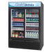 A black Turbo Air refrigerated glass door merchandiser full of soda and water.