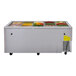 A Turbo Air stainless steel refrigerated buffet display table with a variety of food in it.