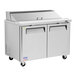 A Turbo Air stainless steel refrigerated sandwich prep table with two doors.