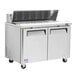 A Turbo Air stainless steel refrigerated sandwich prep table with two doors on a counter.
