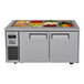 A Turbo Air stainless steel refrigerated buffet display table with food trays of various vegetables.