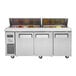 A Turbo Air refrigerated sandwich prep table with three doors and food inside.