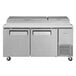 A Turbo Air Super Deluxe stainless steel refrigerated pizza prep table with two doors.