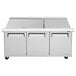 A Turbo Air stainless steel refrigerated sandwich prep table with three doors.
