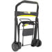 A black and yellow Kantek folding hand truck with wheels.