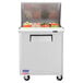 A Turbo Air stainless steel refrigerated sandwich prep table with a large compartment.
