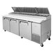 A Turbo Air 93" Super Deluxe Refrigerated Pizza Prep Table with three doors.