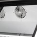 The interior of a white Turbo Air refrigerated merchandiser with two fans.