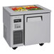 A Turbo Air stainless steel refrigerated buffet display table with food inside.