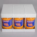 A white box with three plastic containers of Martin's cheese balls.