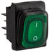 An Avantco green push button switch with white text.