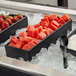 A G.E.T. Enterprises black rectangular salad bowl filled with watermelon cubes on a tray.
