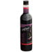 A bottle of DaVinci Gourmet Classic Black Cherry syrup with black liquid inside.