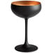 A black wine glass with a copper rim and long stem.