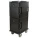 A black Cambro Ultra Camcart for food pans with a handle and wheels.