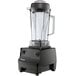A black Vitamix blender with a clear container and black lid.