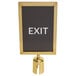 A white sign with the word "exit" in a black frame with gold accents.