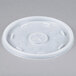 A white plastic Dart lid with a circular hole and a cross-shaped slot.