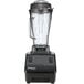 A black Vitamix Drink Machine blender with toggle controls and a clear container.