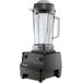 A Vitamix Drink Machine Two-Speed blender with a black base and clear container.