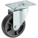 A close up of an Avantco 4" swivel plate caster with a black metal wheel and metal plate.