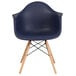 A navy Flash Furniture Alonza plastic chair with wood legs.
