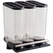 A Rosseto shelf mounted cereal dispenser with three clear plastic containers and black lids.