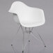 A white plastic Flash Furniture Alonza chair with chrome legs.