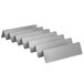A group of metal Vollrath stainless steel French fry racks.