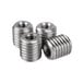A close-up of several stainless steel threaded nuts.