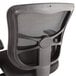 A black Alera office chair with mesh back and armrest.