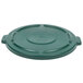 A green Rubbermaid lid for a trash can.