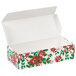 A white Poinsettia holiday candy box with red and green flowers on the lid.