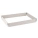 A white rectangular fiberglass sheet pan extender with metal corners.