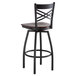 A Lancaster Table & Seating black bar stool with mahogany wood seat and back.