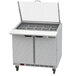 A Beverage-Air stainless steel refrigerated sandwich prep table with two compartments and a lid open.