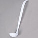 A white plastic Fineline Platter Pleasers ladle with a long handle.