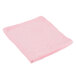A pink microfiber cloth on a white background.