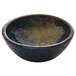 A Playground Sea Dip Dish with a blue and brown speckled surface.