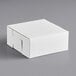 A white 9" x 9" x 4" mini cupcake box with a reversible insert on a gray surface.