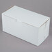A white 8" x 4" x 4" cupcake box with a lid on a gray surface.