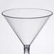 A clear plastic martini glass with a stem.