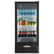 A Beverage-Air black glass door refrigerator filled with soda bottles and condiments.