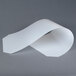A white paper roll on a gray Metro shelf inlay.