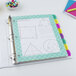 A binder with Avery Ultralast colorful dividers.
