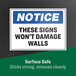 An Avery Surface Safe sign label on a wall.