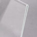 A clear plastic displayette with a white background and edge.
