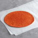 A Father Sam's Bakery roasted red pepper tortilla on a white paper.