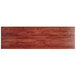 A Lancaster Table & Seating rectangular wooden table top with a mahogany finish.